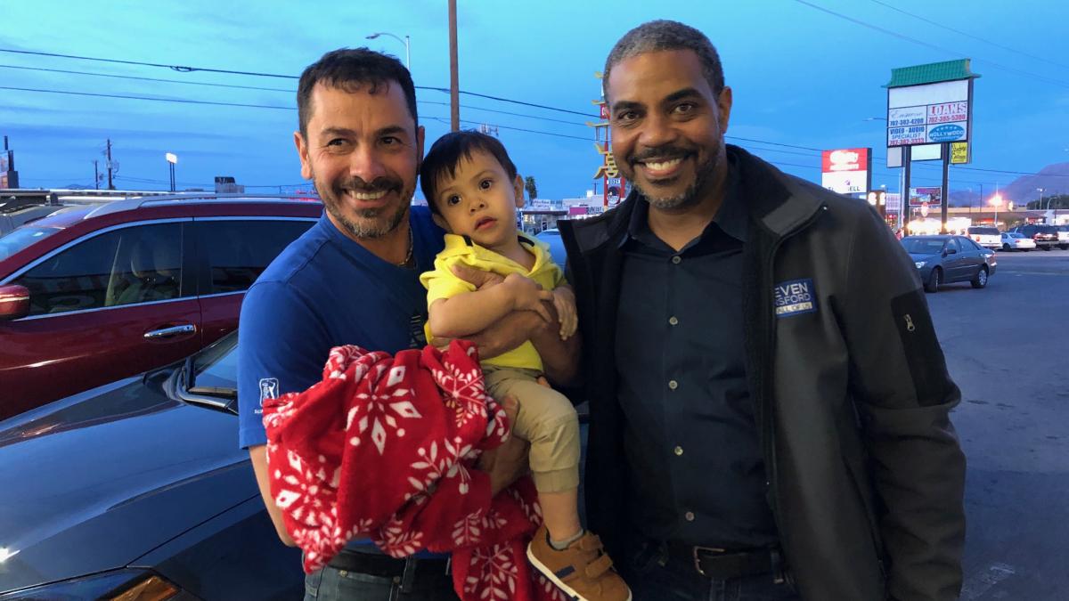 Rep. Horsford with a family in parking lot