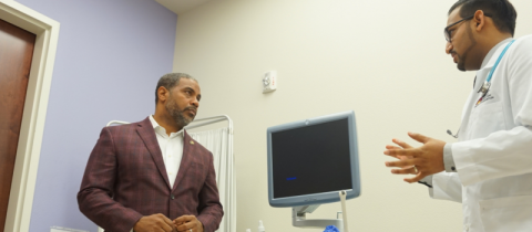 Rep. Horsford talking with Doctor